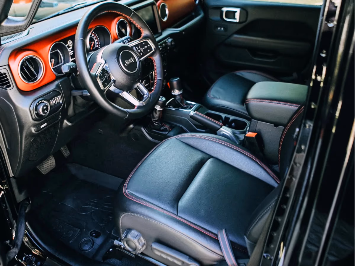 Detailed black leather interior of a Jeep